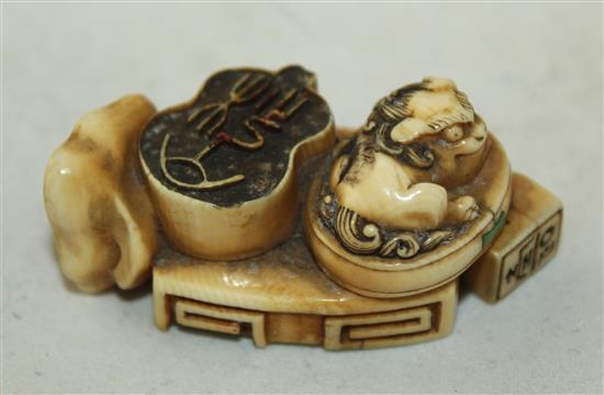 A Japanese ivory multi seal netsuke, 19th century, 5cm